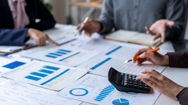 Business Professionals Reviewing Charts